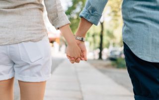 Couple holding hands